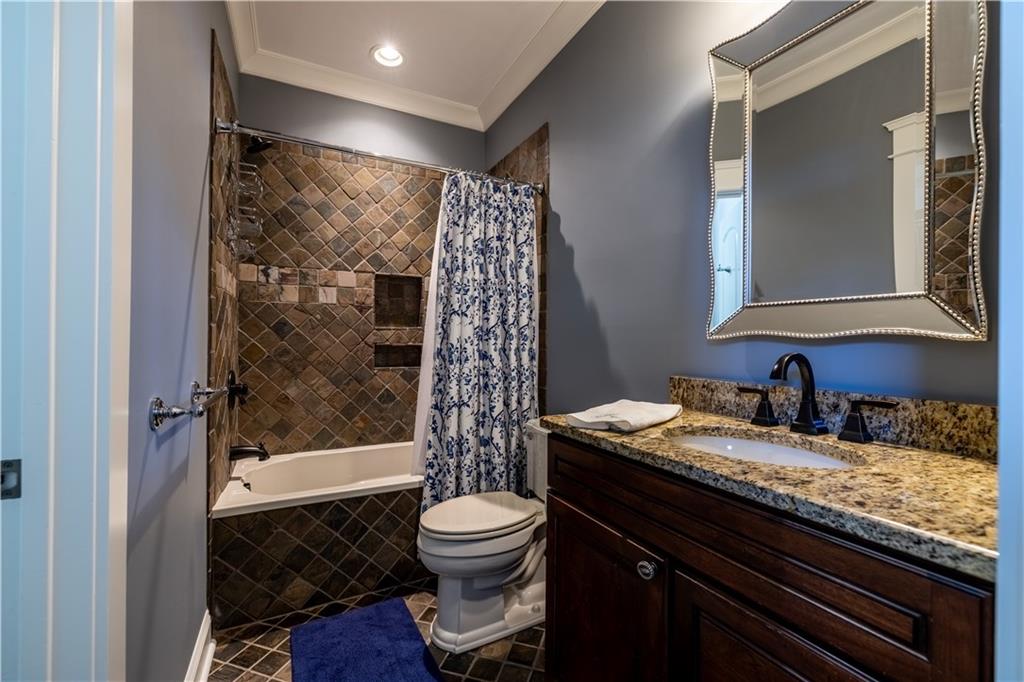 525 North River Road Northeast Rome, GA 30161 - Photo 70 of 101 a bathroom with a granite countertop sink toilet and shower