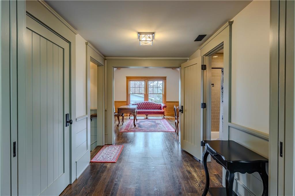 525 North River Road Northeast Rome, GA 30161 - Photo 83 of 101 a view of a hallway with couches and dining table with wooden floor