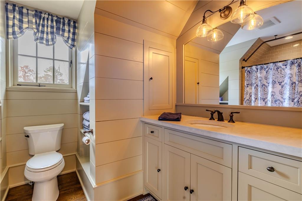 525 North River Road Northeast Rome, GA 30161 - Photo 88 of 101 a bathroom with a toilet sink and mirror