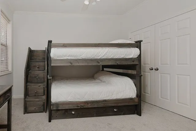 a utility room with cabinets dryer and washer