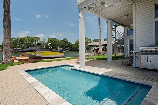 front view of a brick house with a yard