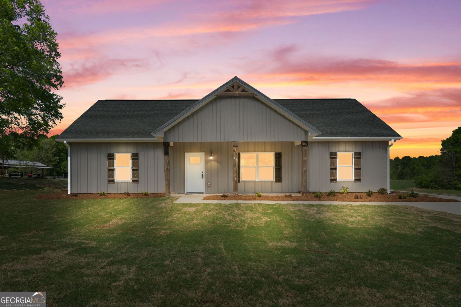 a front view of a house with a yard