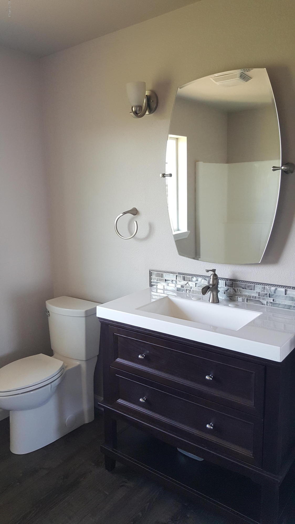135 Slavin Heights Road Yakima, WA 98903 - Photo 20 of 25 a bathroom with a toilet sink and mirror