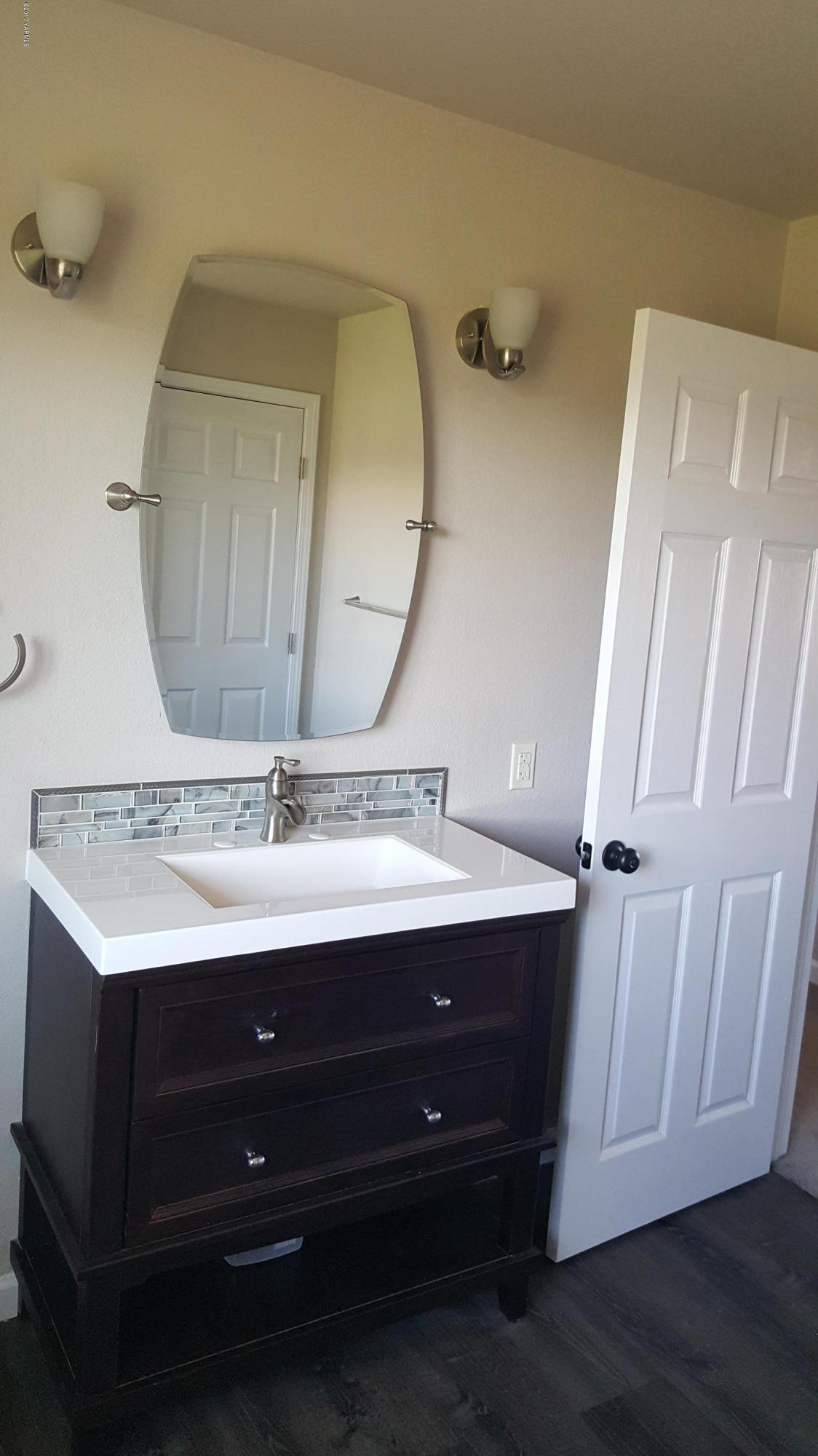 135 Slavin Heights Road Yakima, WA 98903 - Photo 21 of 25 a bathroom with a double vanity sink and mirror