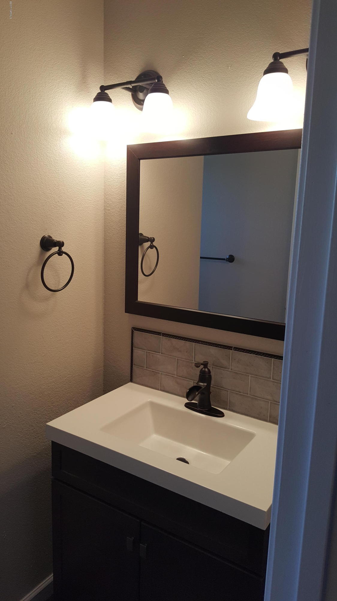 135 Slavin Heights Road Yakima, WA 98903 - Photo 24 of 25 a bathroom with a sink and mirror