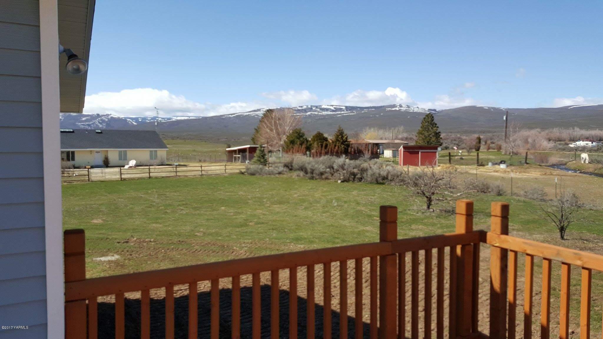 135 Slavin Heights Road Yakima, WA 98903 - Photo 7 of 25 a view of a lake from a balcony