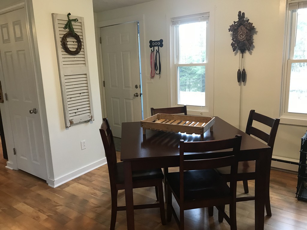 43 Parmenter Road Oakham, MA 01068 - Photo 4 of 13 a view of a dining room with furniture and window