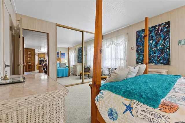 a view of a bedroom with furniture and bathroom