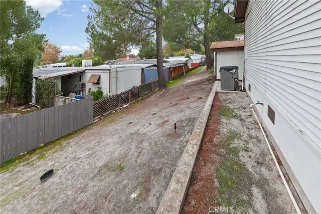 a sitting area with furniture and wooden floor