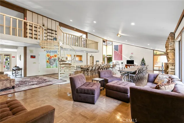 a dining room with furniture and window