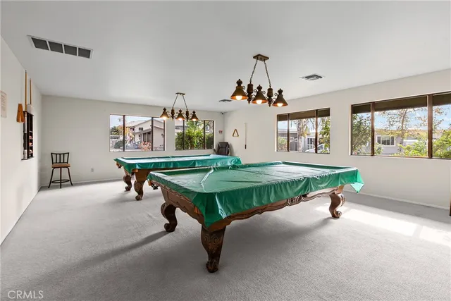 a living room with furniture and windows