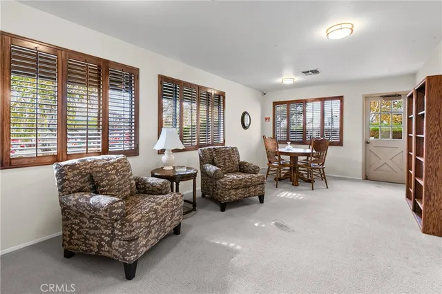 a view of a backyard with sitting area