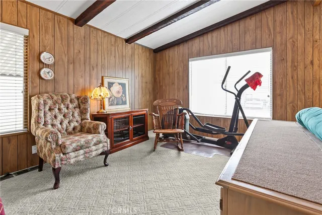 a bedroom with furniture and a window
