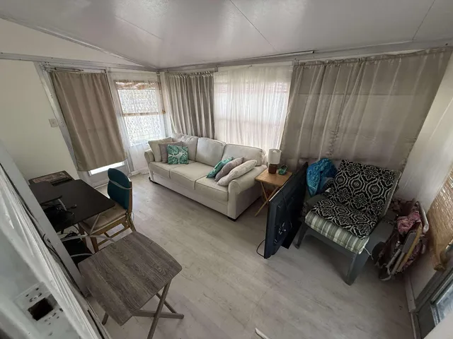 a kitchen with stainless steel appliances granite countertop lots of counter top space and wooden floor