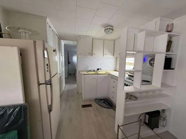 a white toilet sitting next to a bathroom sink