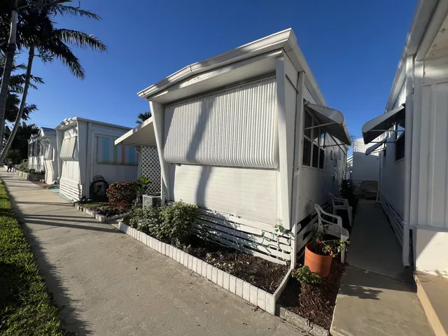 a living room with furniture and flowers