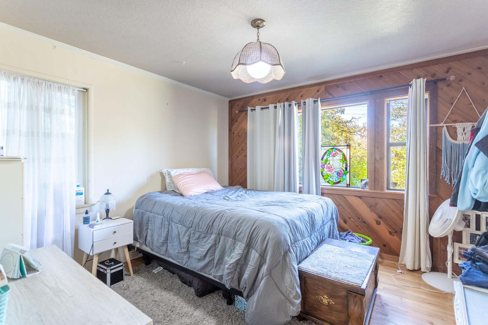 1715 Barbara Road Redding, CA 96003 - Photo 13 of 32 a bedroom with a bed and a chandelier
