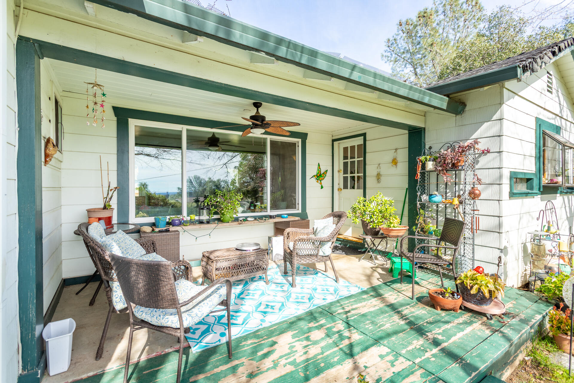 1715 Barbara Road Redding, CA 96003 - Photo 21 of 32 a outdoor space with patio the couches and a dining table and chairs with potted plants