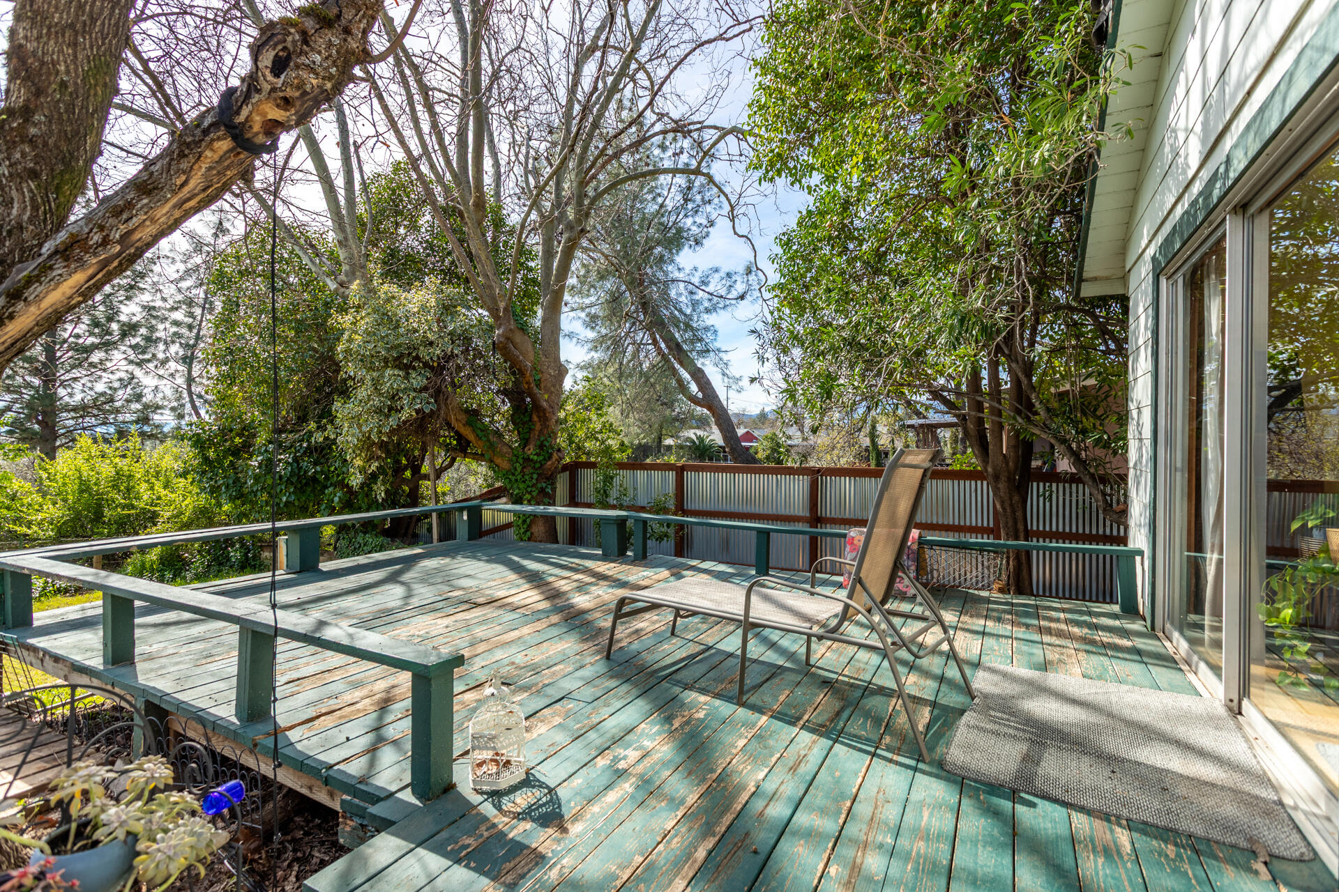 1715 Barbara Road Redding, CA 96003 - Photo 23 of 32 a view of deck with chairs and floor to ceiling window