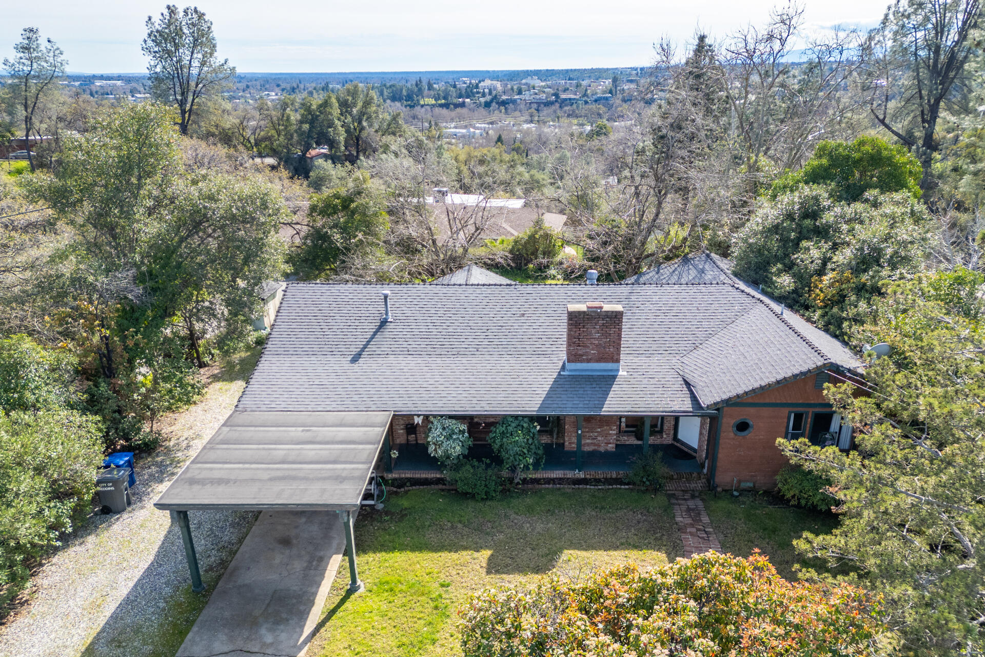 1715 Barbara Road Redding, CA 96003 - Photo 32 of 32 an aerial view of a house with a yard table and chairs