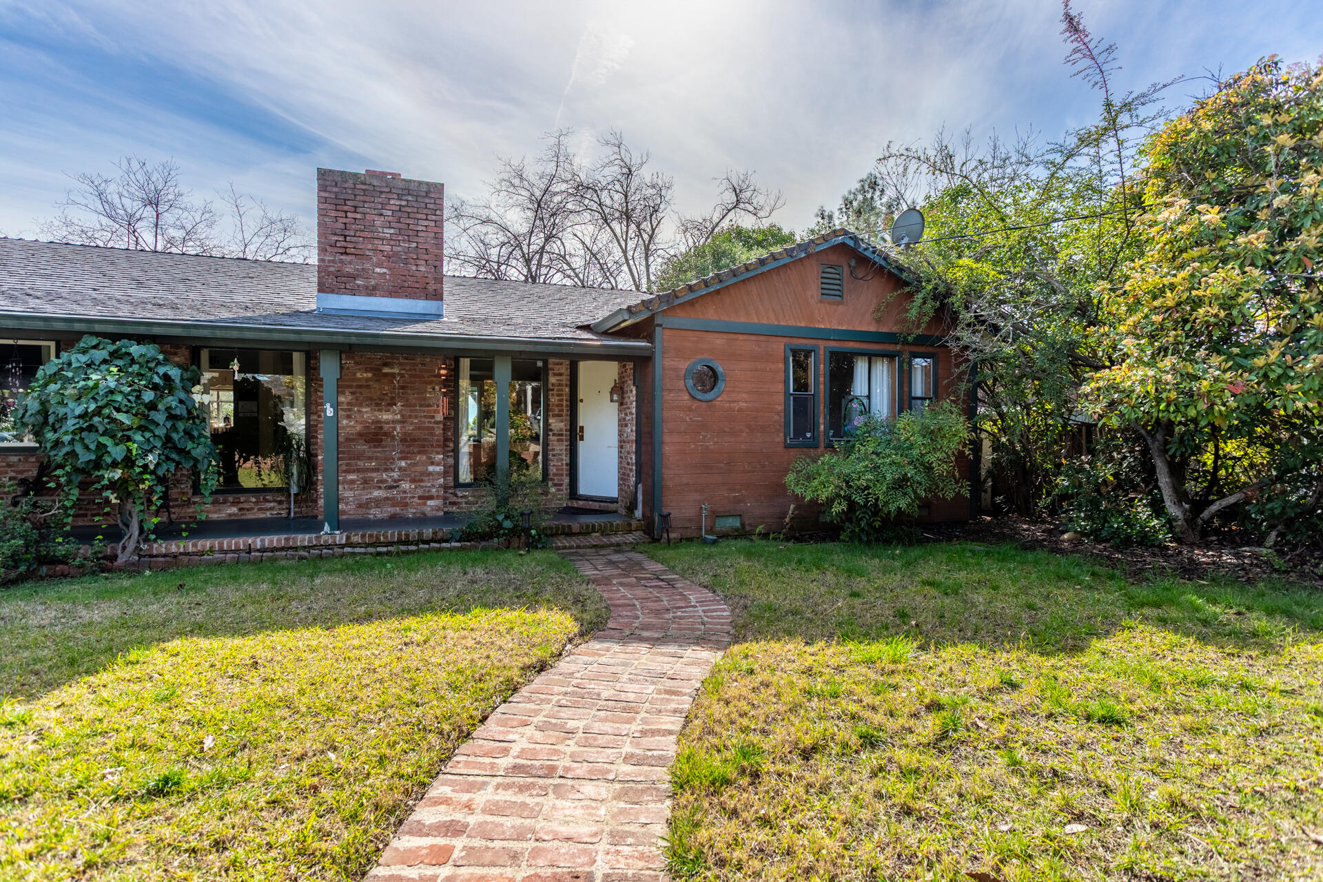 1715 Barbara Road Redding, CA 96003 - Photo 6 of 32 a view of a house with garden