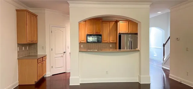 a hallway with sliding door and wooden floor