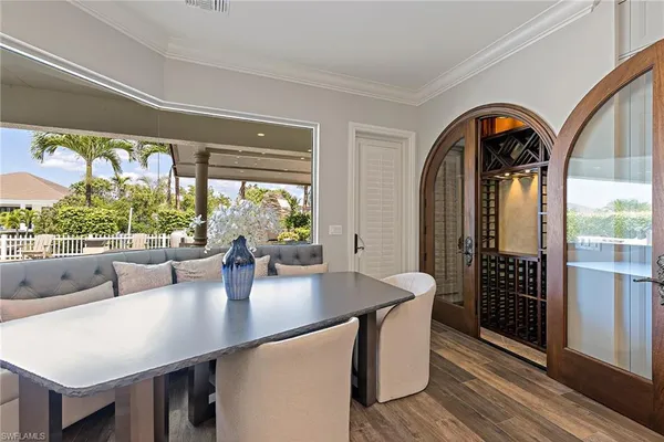 a view of a dining room with furniture window and outside view