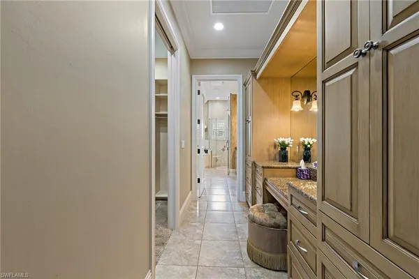a bathroom with a glass door shower a sink and a mirror