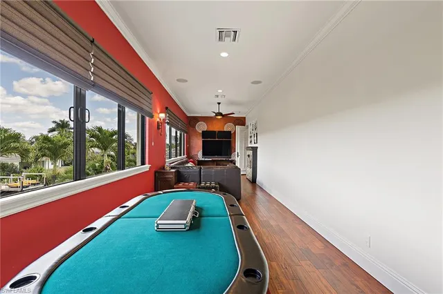 a room with furniture and a large window