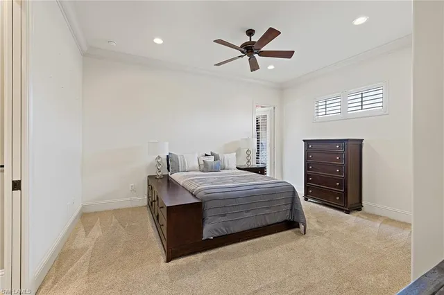 a bedroom with a bed dresser and a window