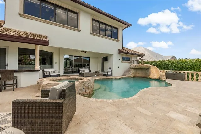 a front view of a house with swimming pool