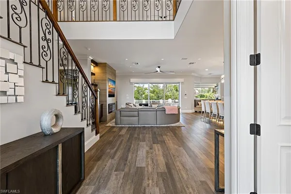 a view of a living room with wooden floor