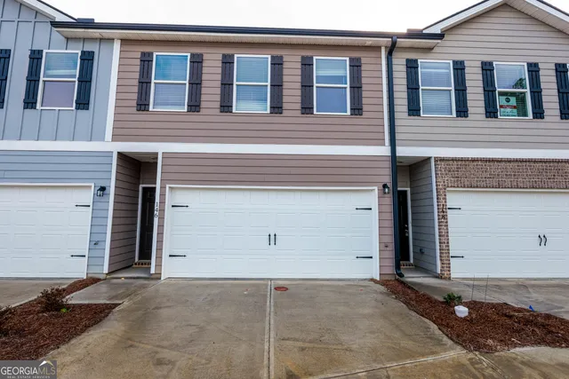 a view of house with garage