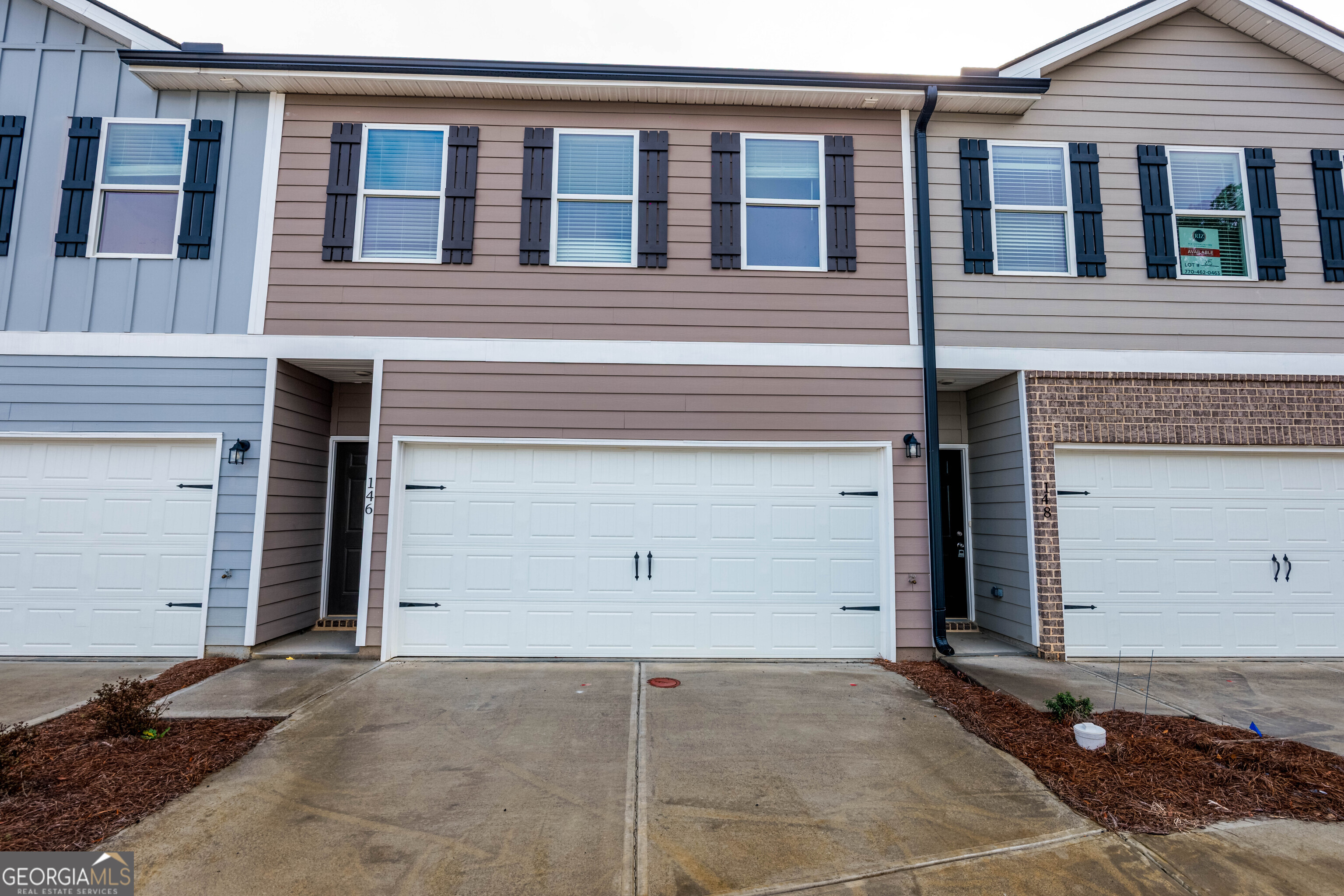 a view of house with garage