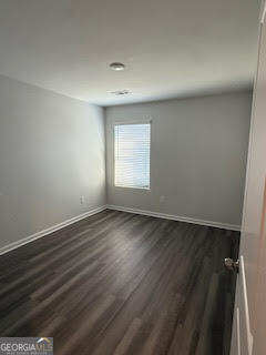 146 Brexley Drive Calhoun, GA 30701 - Photo 23 of 28 an empty room with wooden floor and windows
