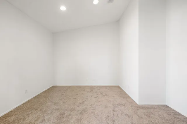 a work room with furniture a potted plant and a potted plant