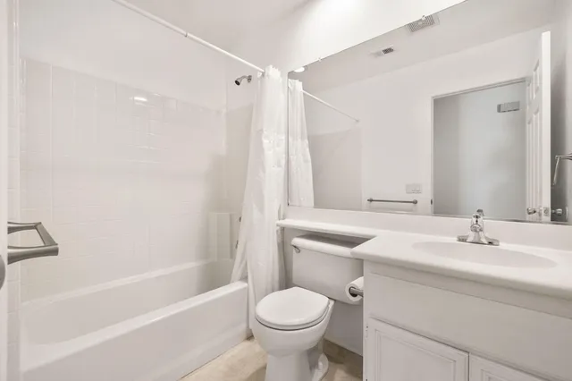 a view of house with backyard and seating space