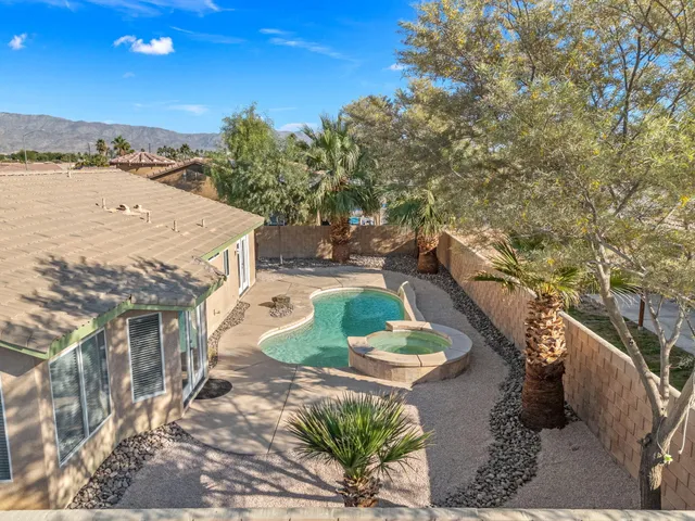a view of a big house with a big yard