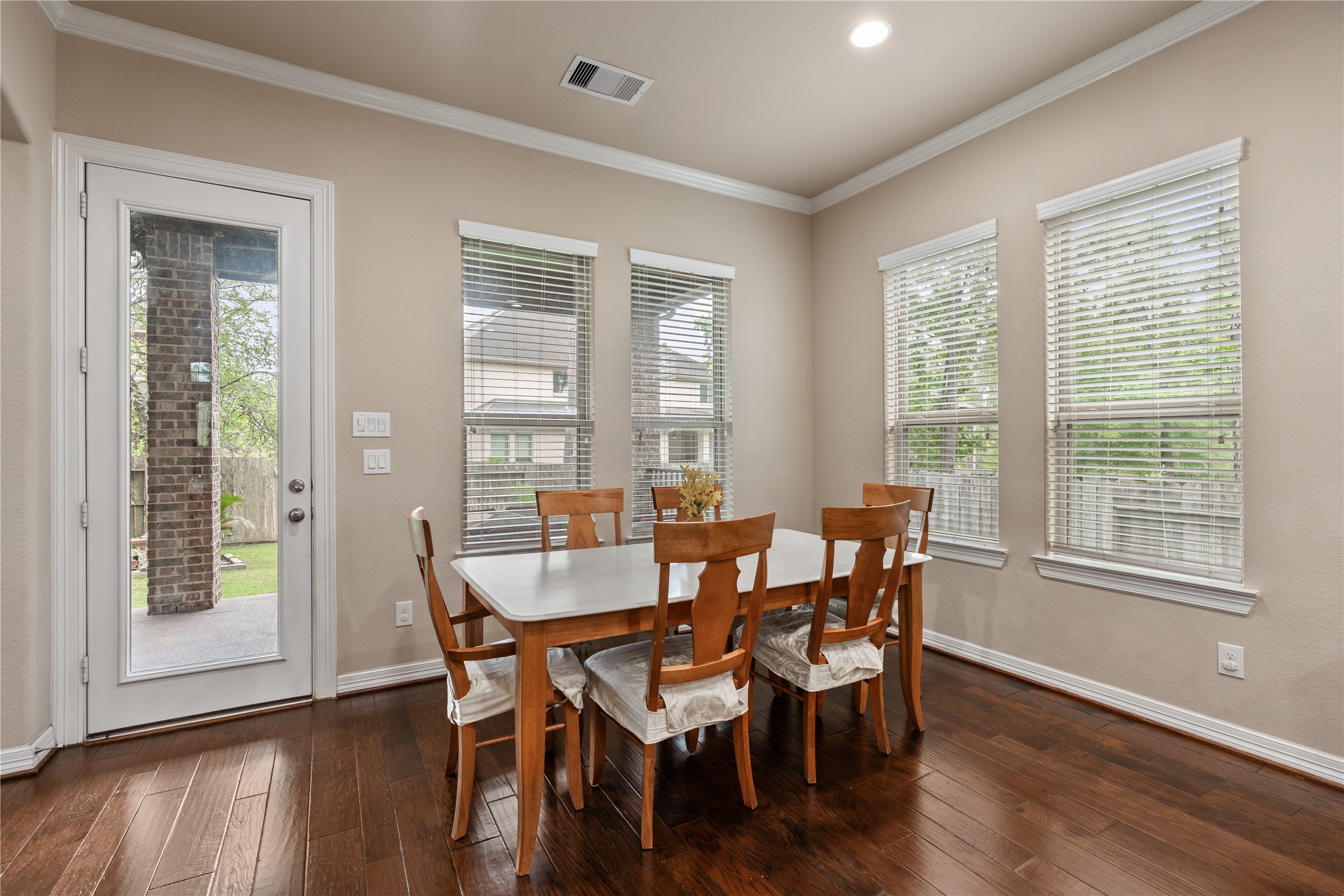 2607 Tree Swallow Bluff Path Spring, TX 77389 - Photo 17 of 44 a view of a dining room with furniture and wooden floor