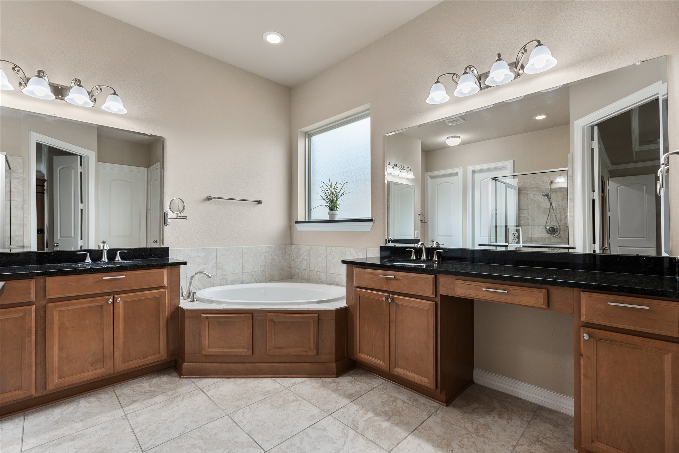 2607 Tree Swallow Bluff Path Spring, TX 77389 - Photo 20 of 44 a large bathroom with a large tub sink and mirror