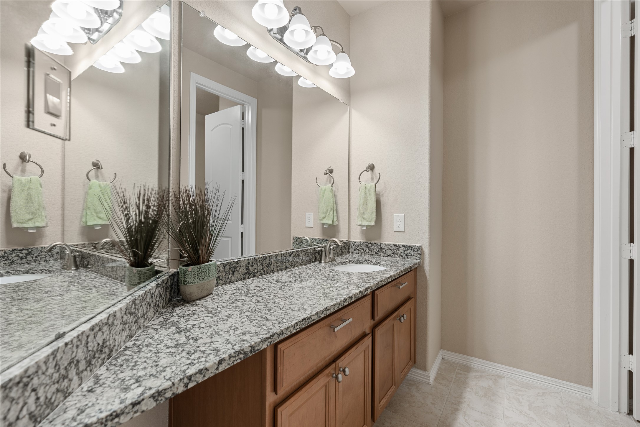 2607 Tree Swallow Bluff Path Spring, TX 77389 - Photo 29 of 44 a bathroom with a granite countertop sink and a mirror