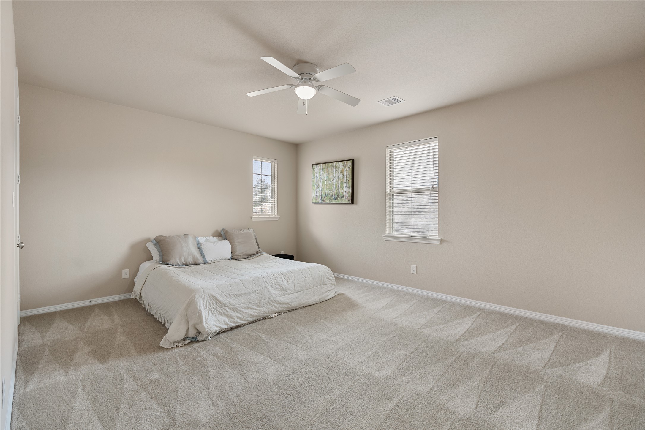 2607 Tree Swallow Bluff Path Spring, TX 77389 - Photo 30 of 44 a bedroom with a large bed and a window