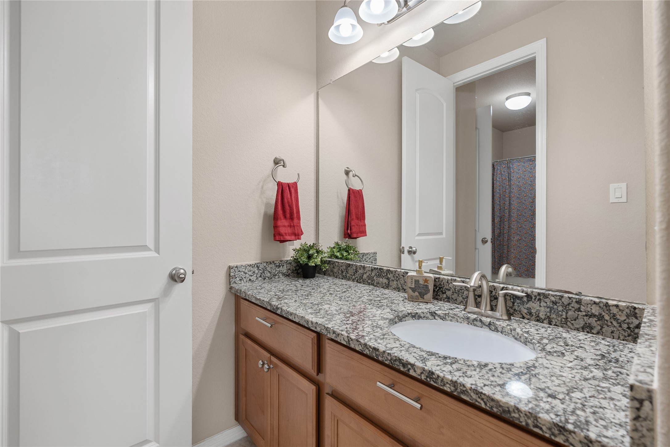 2607 Tree Swallow Bluff Path Spring, TX 77389 - Photo 31 of 44 a bathroom with a granite countertop double vanity sink and a mirror