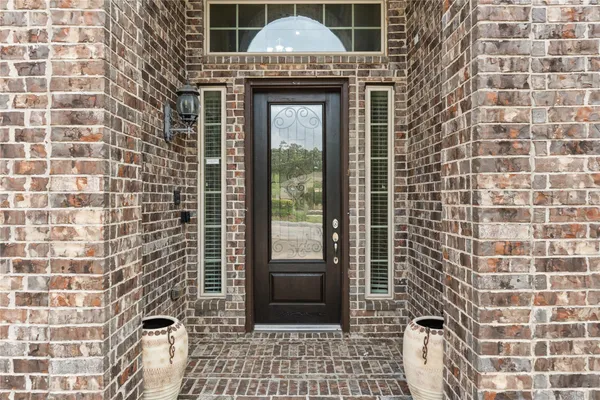 a front view of a house with a glass door