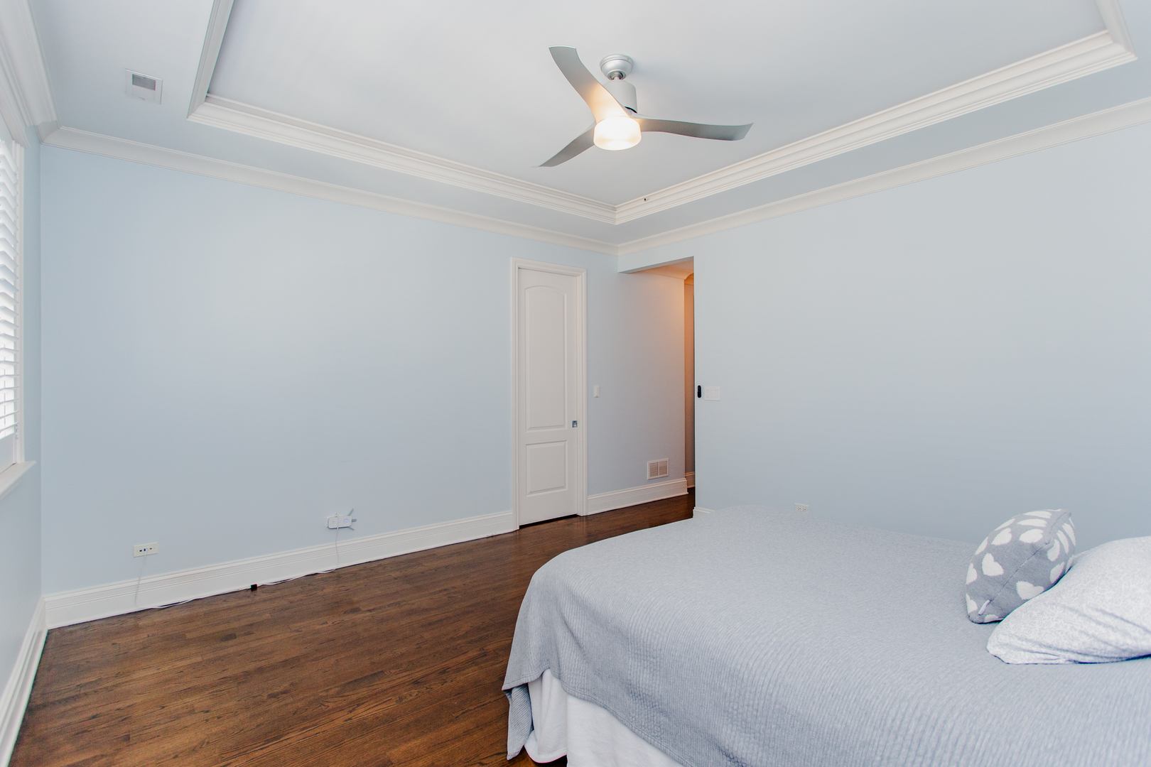 1238 West Jackson Boulevard, Unit 3W Chicago, IL 60607 - Photo 11 of 23 a bedroom with a bed and wooden floor
