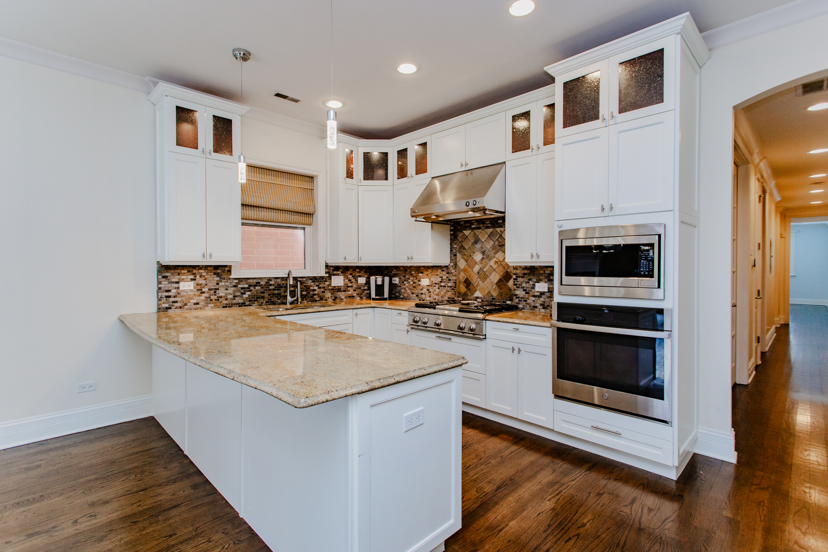 1238 West Jackson Boulevard, Unit 3W Chicago, IL 60607 - Photo 7 of 23 a kitchen with stainless steel appliances granite countertop a stove and a sink