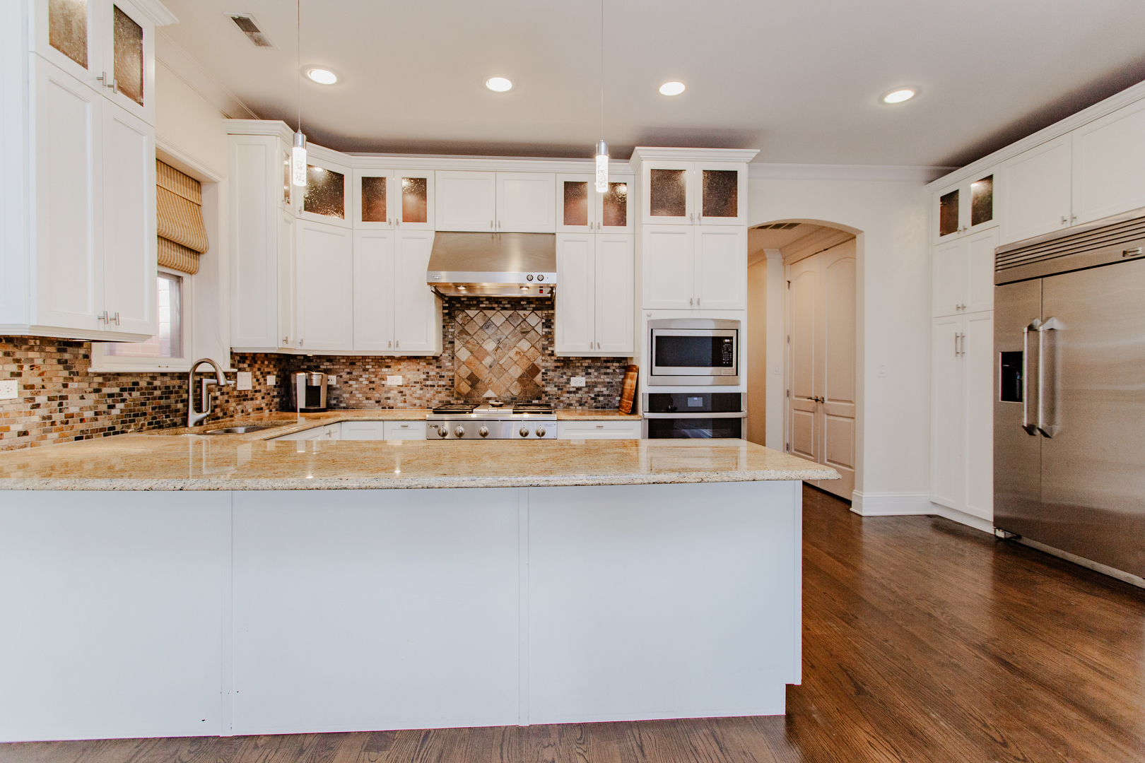 1238 West Jackson Boulevard, Unit 3W Chicago, IL 60607 - Photo 9 of 23 a view of kitchen with stainless steel appliances granite countertop a sink and a refrigerator