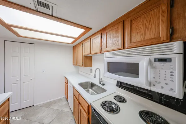 a kitchen with a stove and a microwave