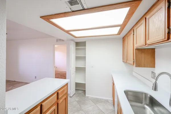 a kitchen that has a sink and a stove