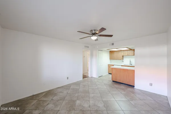 a view of a kitchen with a sink cabinet and a window